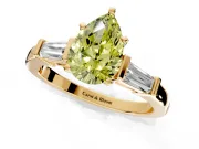 3 Stone Engagement Ring Setting for Fancy Yellow Pear-Shaped Center with Channel Baguette Accents and Prong Head in Yellow Gold