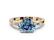 3 Stone Engagement Ring Setting for Fancy Blue Heart-Shaped Center with Baguette Accents and Prong Head in Yellow Gold