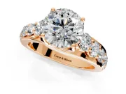Solitaire Engagement Ring Setting for Round Cut Center with Graduated Shared Prongs and Prong Head in Rose Gold