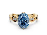 Solitaire Engagement Ring Setting for Fancy Blue Oval Center with Accented Twist Band and Leaf Prong Head in Yellow Gold