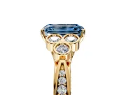 Cluster Engagement Ring Setting for Fancy Blue Emerald Cut Center with Bezel Accent Clusters and Prong Head in Yellow Gold