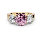 3 Stone Engagement Ring Setting for Fancy Pink Round Cut Center with Raised Basket Heads and Prong Head in Yellow Gold