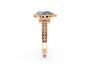Halo Engagement Ring Setting for Fancy Blue Pear-Shaped Center with Outer Bezel Rim, Pave Band and Prong Head in Rose Gold
