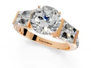 Channel-Set Engagement Ring Setting for Round Cut Center with Baguette Band and Prong Head in Rose Gold