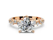 Solitaire Engagement Ring Setting for Heart-Shaped Center with Trailing Leaf Accent Band and Prong Head in Rose Gold
