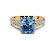 Solitaire Engagement Ring Setting for Fancy Blue Radiant Cut Center with Round Cut Channel Band and Prong Head in Yellow Gold