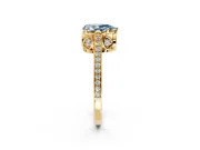 Cathedral Engagement Ring Setting for Fancy Blue Pear-Shaped Center with Antique-Style Pave Band and Prong Head in Yellow Gold