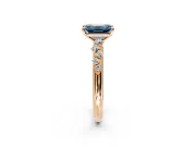 Cluster Engagement Ring Setting for Fancy Blue Emerald Cut Center with Round Cut Accent Band and Prong Head in Rose Gold