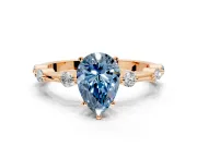 Solitaire Engagement Ring Setting for Fancy Blue Pear-Shaped Center with Bezel Station Band and Prong Head in Rose Gold