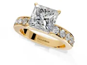 Solitaire Engagement Ring Setting for Princess Cut Center with Channel-Set Accents and Prong Head in Yellow Gold