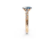 Cluster Engagement Ring Setting for Fancy Blue Oval Center with Round Cut Accent Band and Prong Head in Rose Gold