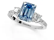 3 Stone Engagement Ring Setting for Fancy Blue Emerald Cut Center with Round Cut Side Accents and Prong Head in White Gold
