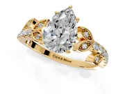 Leaf Motif Engagement Ring Setting for Pear-Shaped Center with Pave Band and Prong Head in Yellow Gold