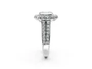 Large Accent Halo Engagement Ring Setting for Emerald Cut Center with Pave Split Shank and Prong Head in Platinum