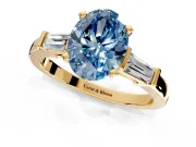3 Stone Engagement Ring Setting for Fancy Blue Oval Center with Channel Baguette Accents and Prong Head in Yellow Gold