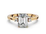 3 Stone Engagement Ring Setting for Emerald Cut Center with Low-Set Round Cut Accents and Prong Head in Yellow Gold