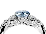 Cluster Engagement Ring Setting for Fancy Blue Oval Center with Round Cut Accent Frame and Prong Head in White Gold