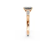 3 Stone Engagement Ring Setting for Emerald Cut Center with Channel Baguette Accents and Prong Head in Rose Gold