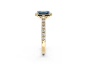 Halo Engagement Ring Setting for Fancy Blue Emerald Cut Center with Full Pave Band and Prong Head in Yellow Gold