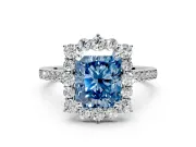 Halo Engagement Ring Setting for Fancy Blue Radiant Cut Center with Single-Row Pave, Open Basket and Prong Head in Platinum