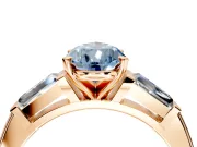 3 Stone Engagement Ring Setting for Fancy Blue Pear-Shaped Center with Tapered Baguettes, Plain Band and Prong Head in Rose Gold