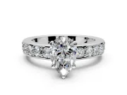 Solitaire Engagement Ring Setting for Pear-Shaped Center with Channel-Set Accents and Prong Head in Platinum