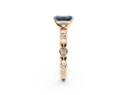 Solitaire Engagement Ring Setting for Fancy Blue Emerald Cut Center with Beaded Bezel Station Band and Prong Head in Rose Gold