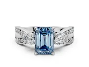 3 Stone Engagement Ring Setting for Fancy Blue Emerald Cut Center with Pave Twist Band and Prong Head in Platinum