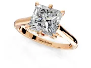 Solitaire Engagement Ring Setting for Princess Cut Center with Cathedral Band and Prong Head in Rose Gold