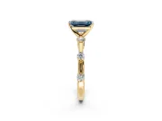 Solitaire Engagement Ring Setting for Fancy Blue Emerald Cut Center with Bezel Station Band and Prong Head in Yellow Gold