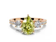 3 Stone Engagement Ring Setting for Fancy Yellow Pear-Shaped Center with Round Cut Side Accents and Prong Head in Rose Gold