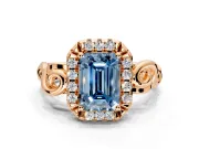 Halo Engagement Ring Setting for Fancy Blue Emerald Cut Center with Open Scroll Shoulders and Prong Head in Rose Gold