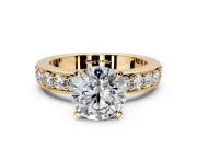 Solitaire Engagement Ring Setting for Round Cut Center with Channel-Set Accents and Prong Head in Yellow Gold