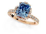 Halo Engagement Ring Setting for Fancy Blue Radiant Cut Center with Openwork Halo, Pave Band and Prong Head in Rose Gold