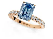 Open Basket Engagement Ring Setting for Fancy Blue Emerald Cut Center with Pave Band and Prong Head in Rose Gold