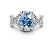 Halo Engagement Ring Setting for Fancy Blue Heart-Shaped Center with Pave Infinity Twist Band and Prong Head in White Gold
