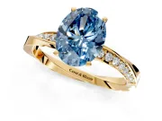 Side Accent Engagement Ring Setting for Fancy Blue Oval Center with Accent Shoulders and Prong Head in Yellow Gold