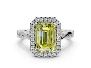 Halo Engagement Ring Setting for Fancy Yellow Emerald Cut Center with Twist Band and Prong Head in White Gold