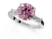 3 Stone Engagement Ring Setting for Fancy Pink Round Cut Center with Channel Baguette Accents and Prong Head in White Gold