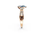 3 Stone Engagement Ring Setting for Fancy Blue Pear-Shaped Center with Pave Split Shank and Prong Head in Rose Gold