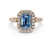 Halo Engagement Ring Setting for Fancy Blue Emerald Cut Center with Raised Halo, Pave Band and Prong Head in Rose Gold