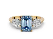 3 Stone Engagement Ring Setting for Fancy Blue Emerald Cut Center with Large Pear-Shaped Accents and Prong Head in Yellow Gold