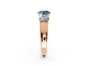 3 Stone Engagement Ring Setting for Fancy Blue Round Cut Center with Raised Basket Heads and Prong Head in Rose Gold