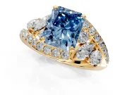 Halo Engagement Ring Setting for Fancy Blue Radiant Cut Center with Marquise and Pave Bypass Band and Prong Head in Yellow Gold