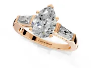 3 Stone Engagement Ring Setting for Pear-Shaped Center with Tapered Baguettes, Plain Band and Prong Head in Rose Gold