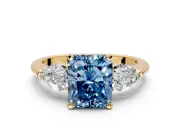 3 Stone Engagement Ring Setting for Fancy Blue Radiant Cut Center with Large Pear-Shaped Accents and Prong Head in Yellow Gold