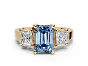 3 Stone Engagement Ring Setting for Fancy Blue Emerald Cut Center with Matching Side Accents and Prong Head in Yellow Gold