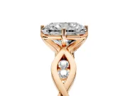 Solitaire Engagement Ring Setting for Radiant Cut Center with Accented Twist Band and Leaf Prong Head in Rose Gold