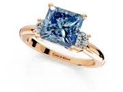 3 Stone Engagement Ring Setting for Fancy Blue Princess Cut Center with Wide Plain Band and Prong Head in Rose Gold