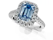 Halo Engagement Ring Setting for Fancy Blue Emerald Cut Center with Narrowing Pave Band and Prong Head in Platinum
